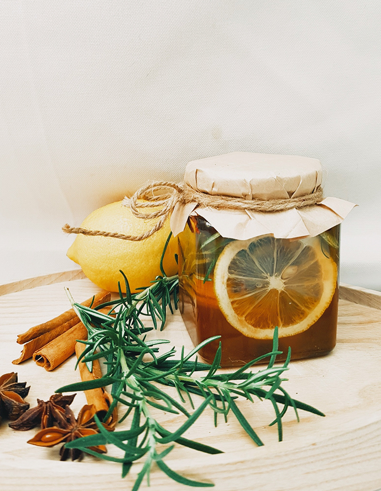 Natural wellness ingredients with lemon, rosemary, and spices
